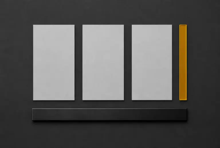 Three blank slips laid side by side with an amber measuring strip